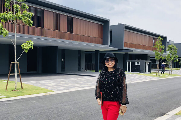 Master Suyen Lim outside a newly completed housing development