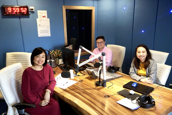 Master Suyen Lim recording a studio interview with two presenters